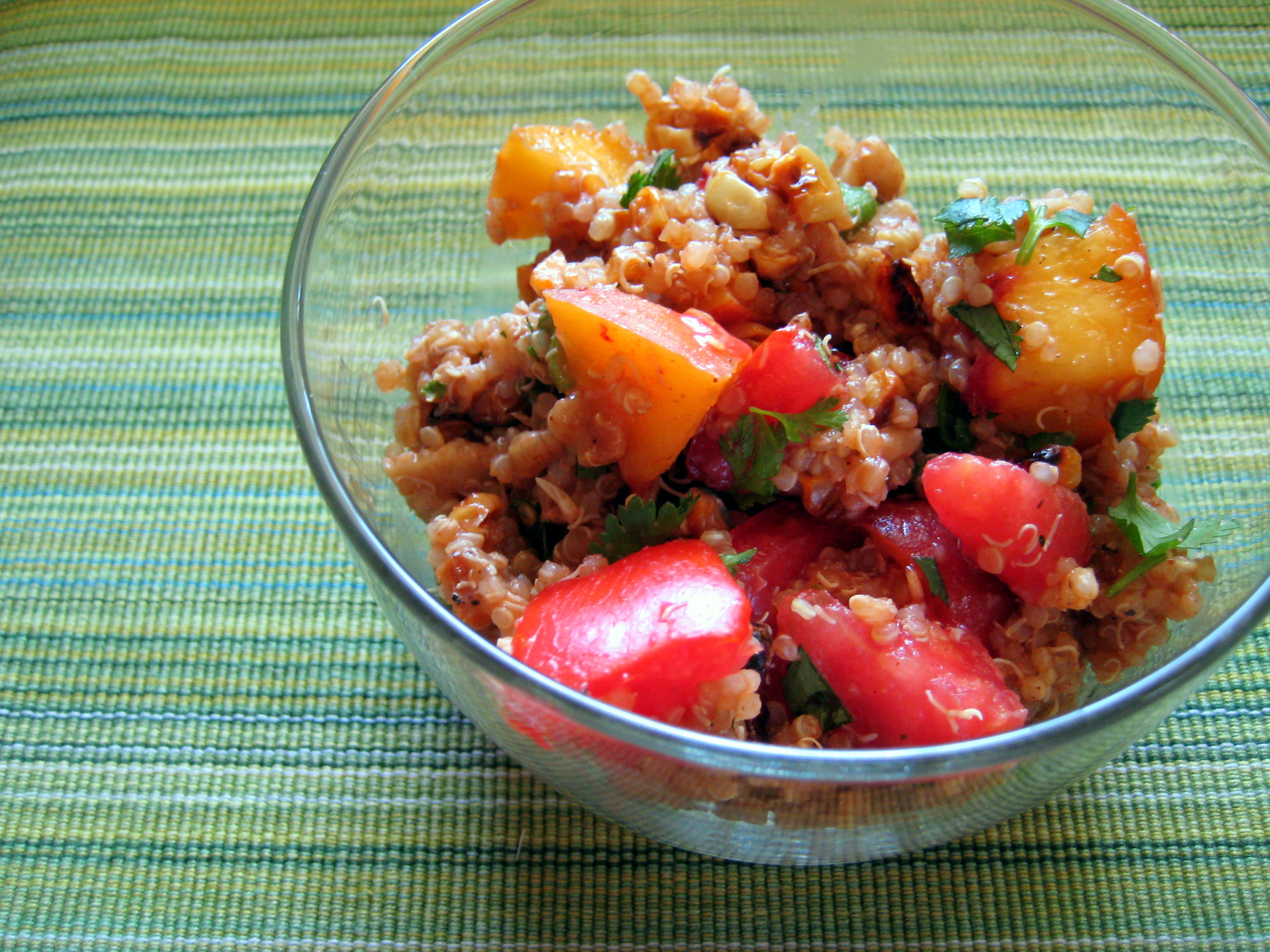 vegan barbecue quinoa salad with peaches, corn, and tomatoes