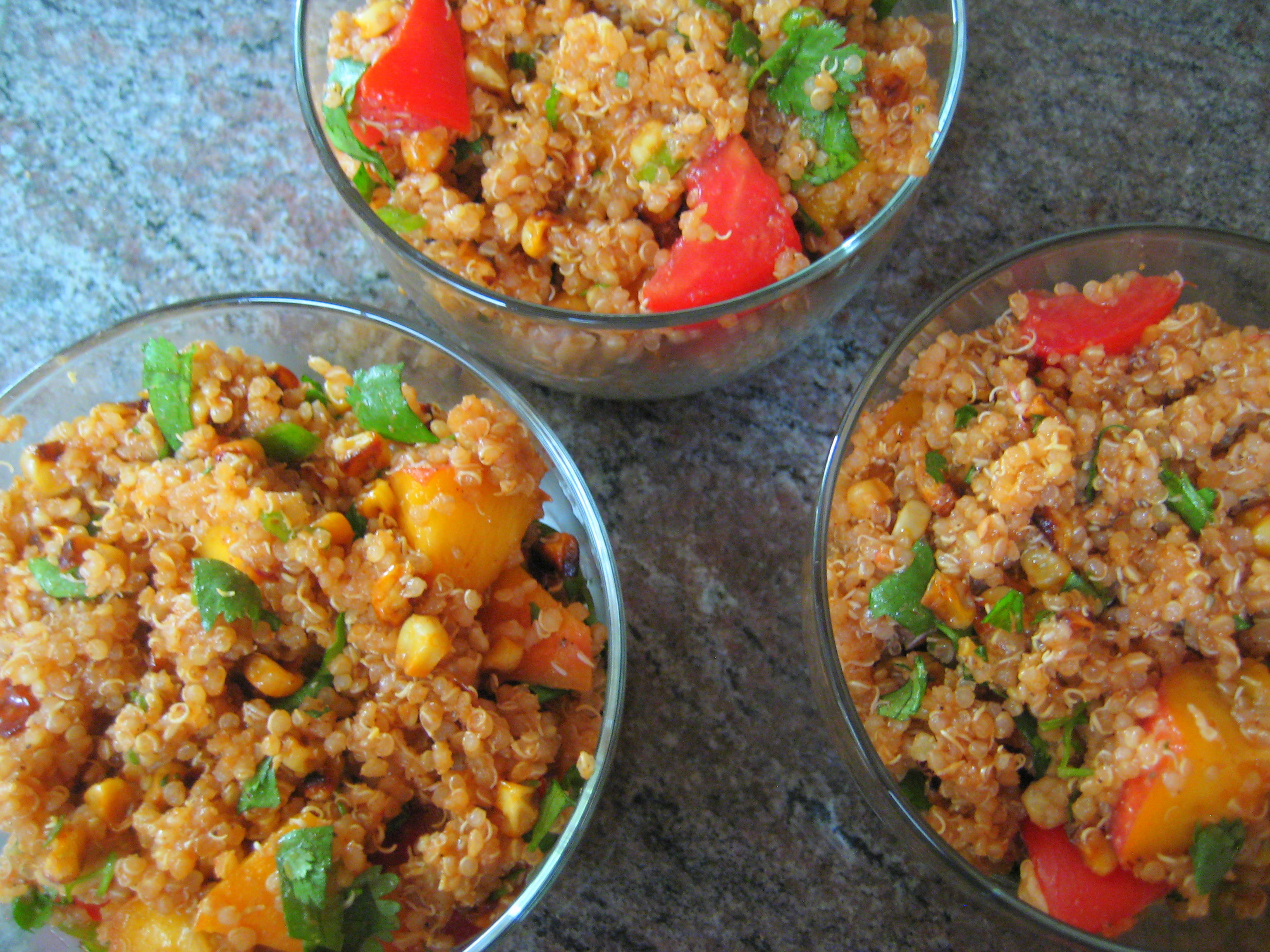 vegan barbecue quinoa salad with peaches, corn, and tomatoes